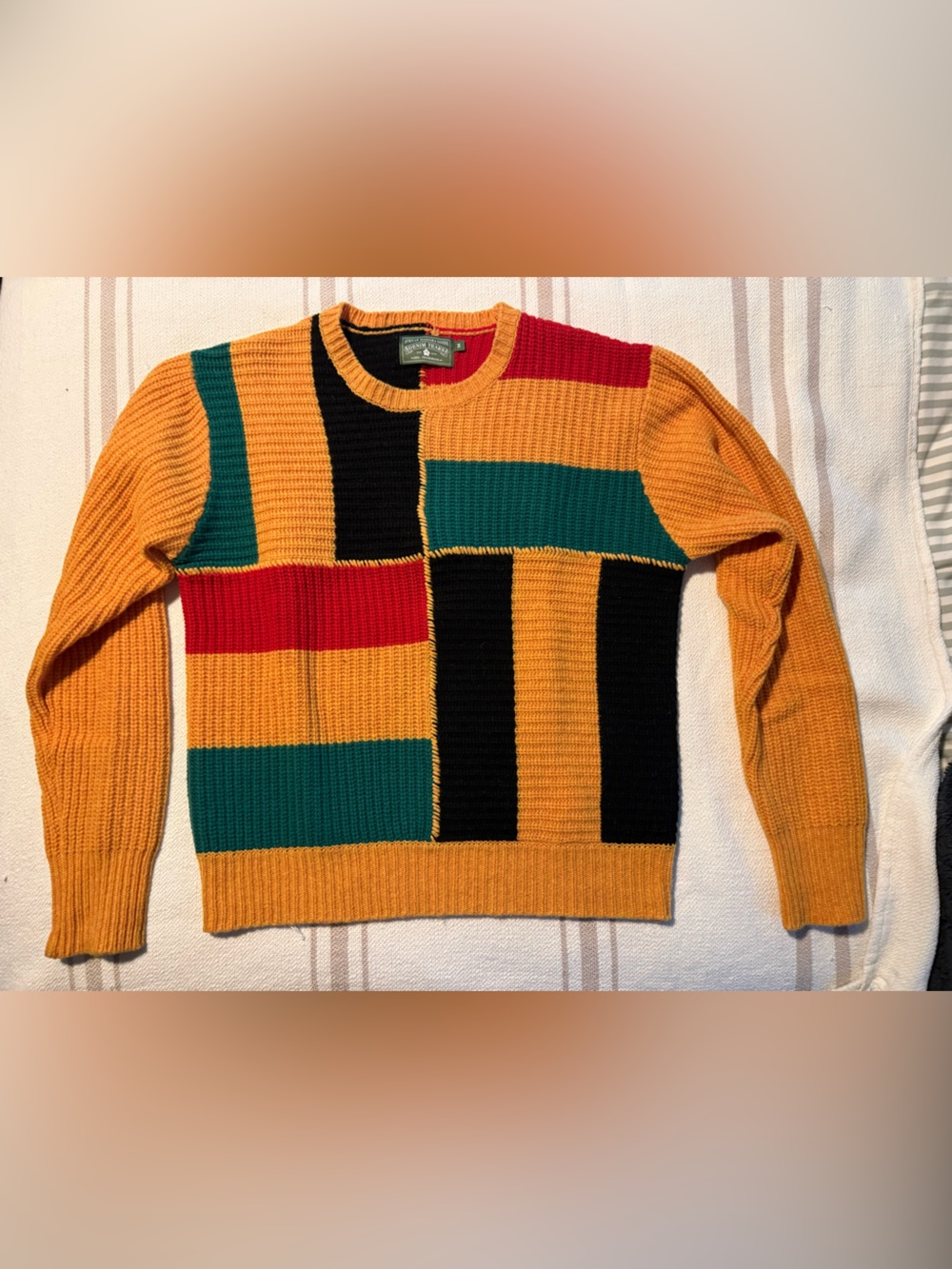DENIM TEARS Colorblock Ribbed Crewneck Sweater in Mustard, Teal, Black & Red
